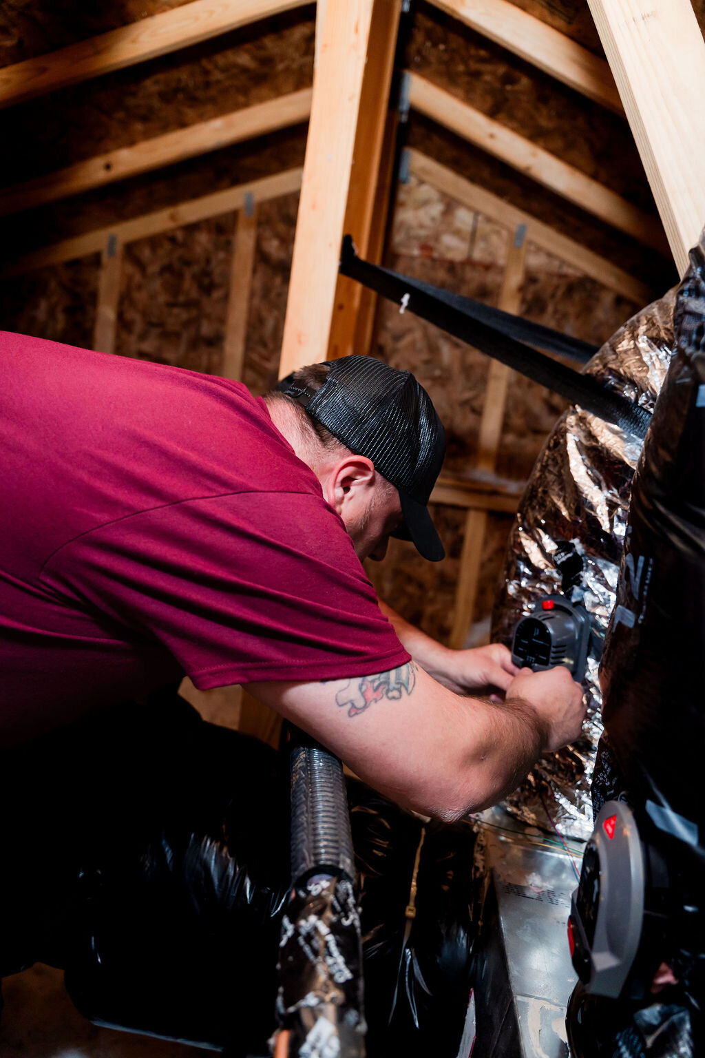 Know A Guy technician repairing a home heating system